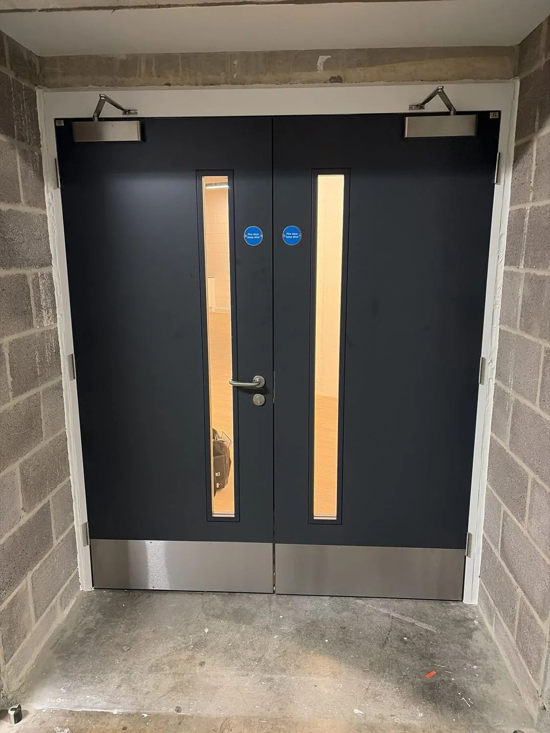 Completed double fire door set with vision panels