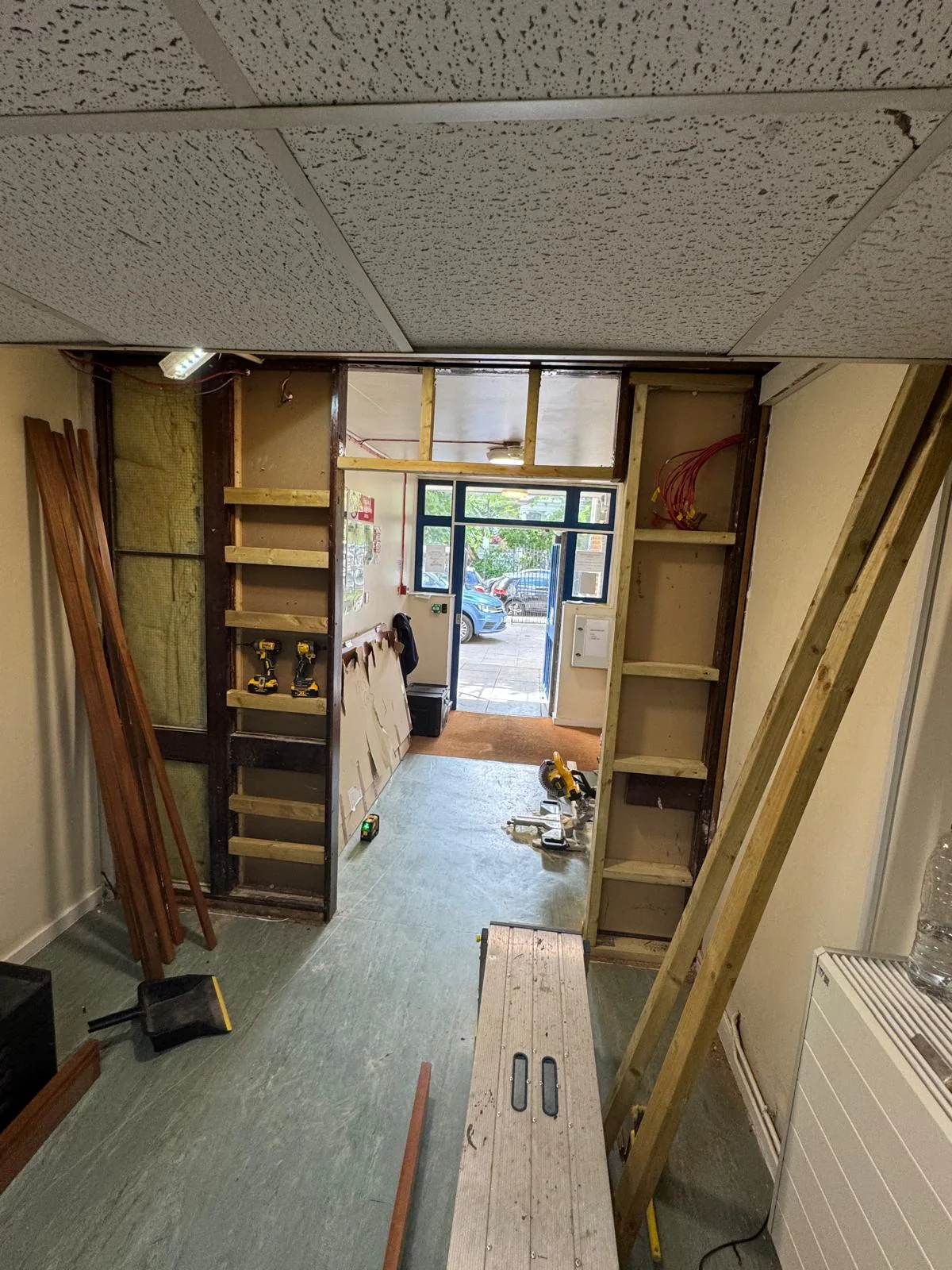 Timber framing work in progress around communal doorway